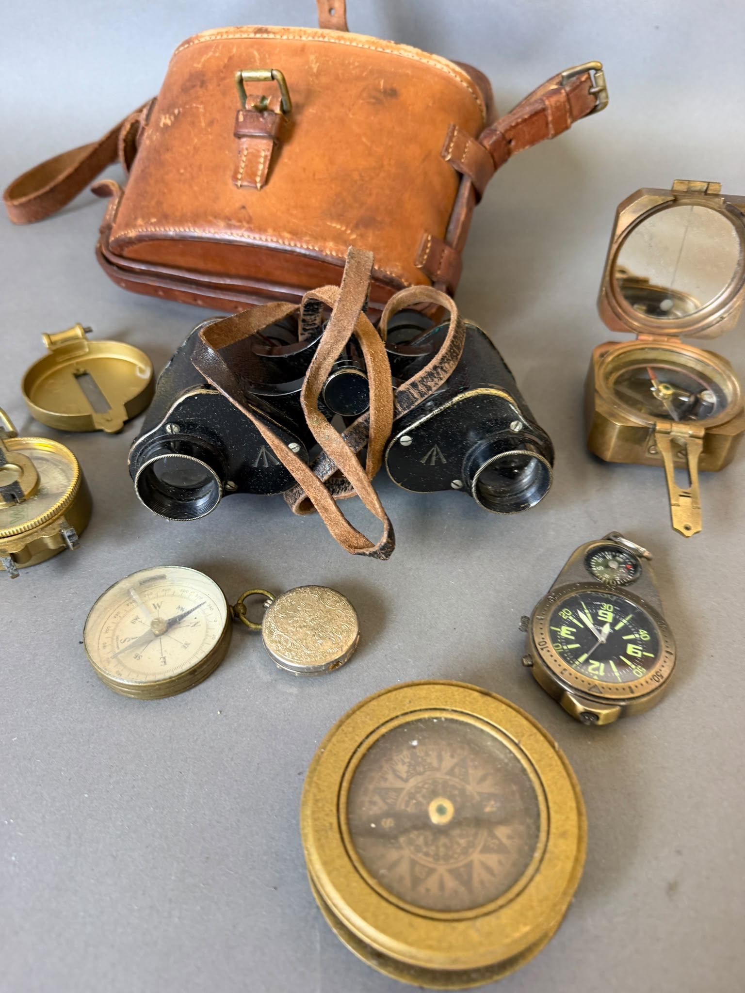 Lot 901 - A selection of compasses and a set of